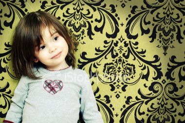 istockphoto_2932249-little-girl-standing-against-wallpaper-wall.jpg